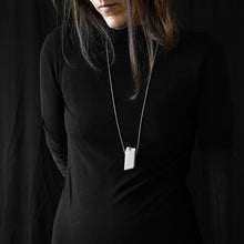 Load image into Gallery viewer, a woman while are wearing blocco 55 in a black background