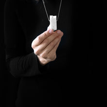 Load image into Gallery viewer, a woman while are wearing blocco 55 in a black background