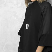 Load image into Gallery viewer, A woman with a blond hair wearing the Grey Rectangle Necklace with a black bluse on a grey background