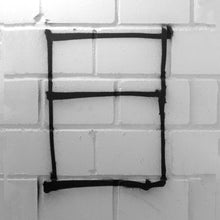 Load image into Gallery viewer, The Megalith project sprayed on a wall