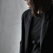 Load image into Gallery viewer, A girl wear Elemento necklace in grey version on black background