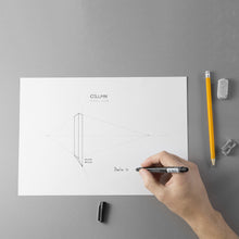 Load image into Gallery viewer, The design on paper of the Column necklace's project with a hand that draws, eraser and sharpener.