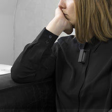 Load image into Gallery viewer, A woman with a blond hair wearing the Black Rectangle Necklace with a black bluse on a grey background