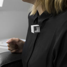 Load image into Gallery viewer, A woman with a blond hair wearing the Grey Zero Necklace with a black bluse on a grey background