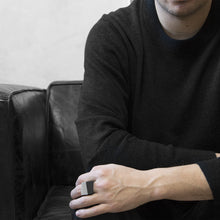 Load image into Gallery viewer, A man wearing the Assembled Ring on their ring finger, a combination of MK3 black asymmetric ring and MK3 Grey asymmetric ring