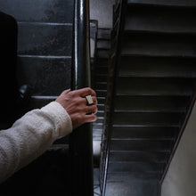 Load image into Gallery viewer, Silver925 square ring is wearing by a man while is going down the steps in a old building