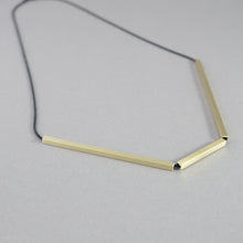 Laden Sie das Bild in den Galerie-Viewer, Geometric necklace with gold-plated bar elements arranged in an architectural angular composition