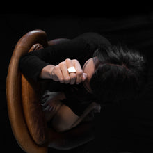 Load image into Gallery viewer, a woman wearing the silver925 square ring while she are sitting on a brown armchair