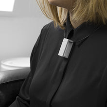 Load image into Gallery viewer, A woman with a blond hair wearing the Grey Rectangle Necklace with a black bluse on a grey background 